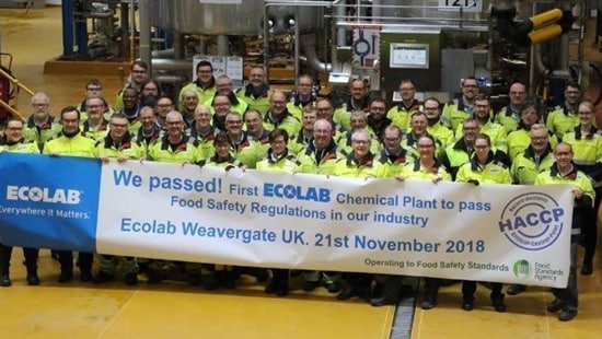 Weavergate associates with banner on HACCP certification